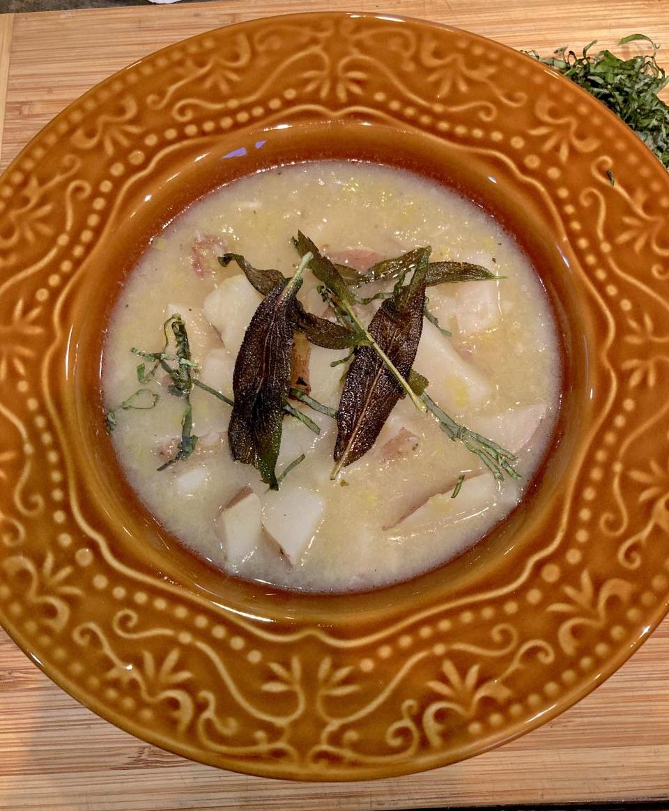 Leek and potato soup with sautéed sage leaves